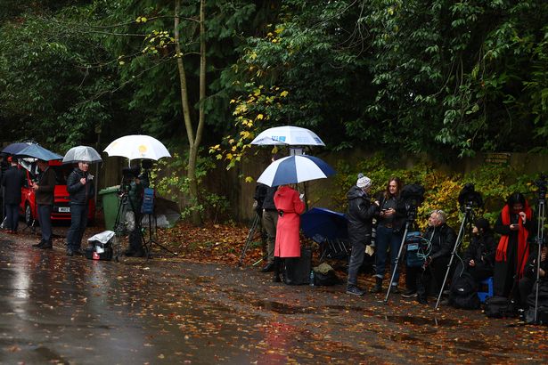 Journalists from as far away as Australia remained outside Andrew's home in miserable weather