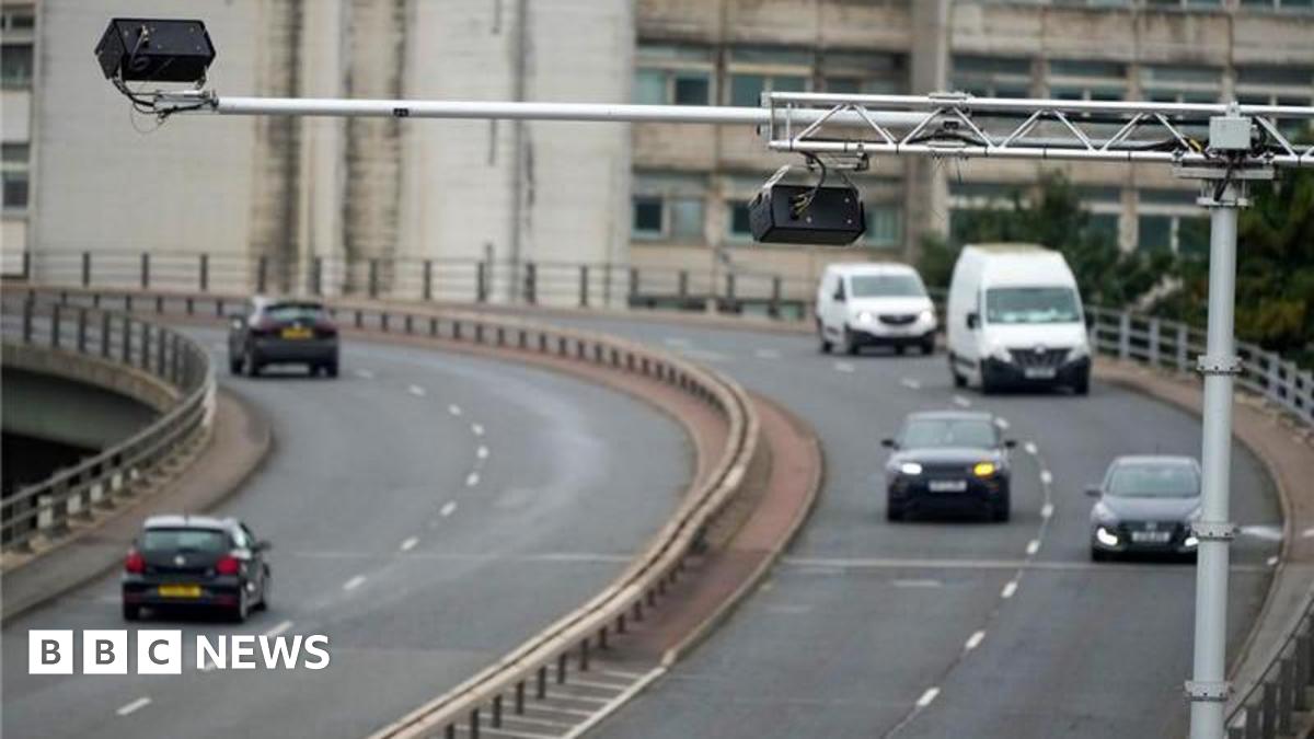 The Mancunian Way, a motorway, with light traffic way travelling in either direction in the day time.