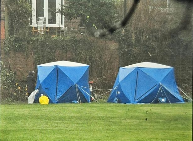 Two tents erected by forensic officers at the rear of a property in Great Cheetham Street West, Higher Broughton, Salford, as the murder inquiry began.