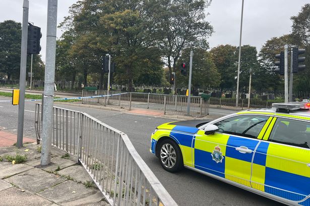 There is a large police presence, with around six or seven cars at the scene