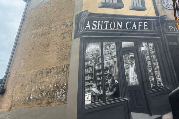 A 'ghost sign' promoting tickets on-board the Titanic has been given a new lease of life thanks to a new mural next to it