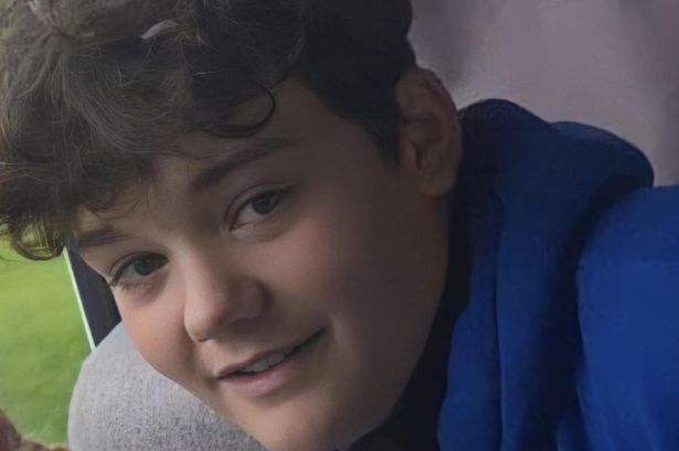 Boy in blue hooded top