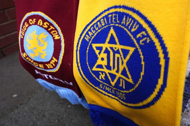 Close up of the Aston Villa (left) and Maccabi Tel Aviv club badges on a scarf