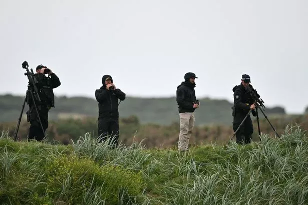 Snipers and security personnel inspect the area before US President Donald Trump he plays golf at the Trump Turnberry Golf Courses