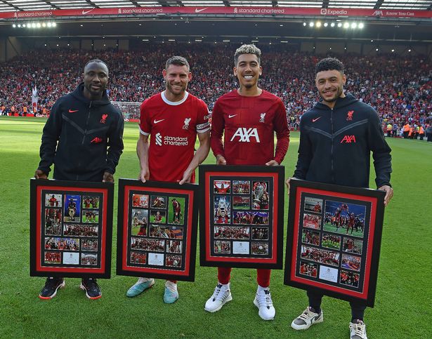 Naby Keita, James Milner, Roberto Firmino and Alex Oxlade-Chamberlain of Liverpool at the end of the Premier League match between Liverpool FC and Aston Villa at Anfield 