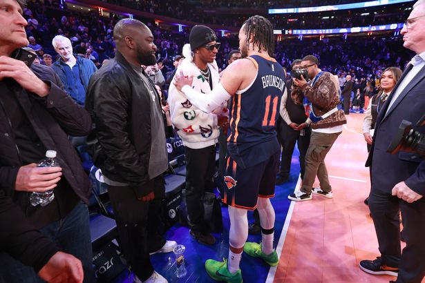 Jalen Brunson of the New York Knicks greets Manchester United forward Marcus Rashford at Madison Square Garden