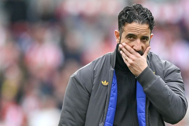 Ruben Amorim holds his hand to his face