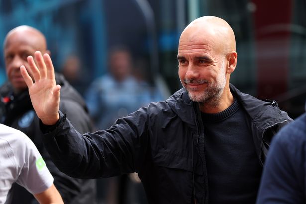 Pep Guardiola, Manager of Manchester City, gestures as he arrives at the stadium prior to the Premier League match between Brentford and Manchester City