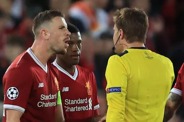 Jordan Henderson confronts referee Dr. Felix Brych after the final whistle of the Champions League semi-final first-leg match between Liverpool and Roma at Anfield