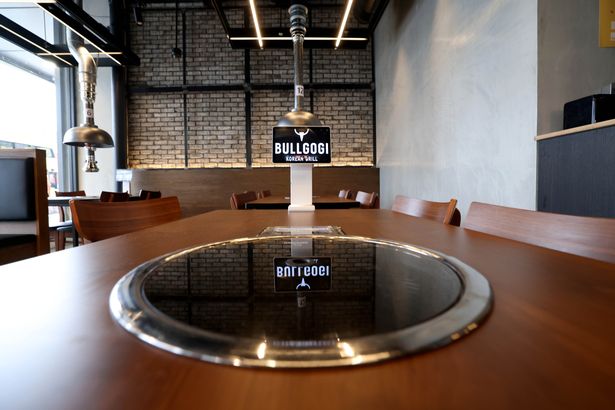 The tables are fitted with grills for customers to cook their own cuts of meat