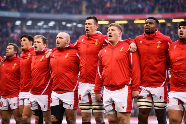 Rugby team line up singing