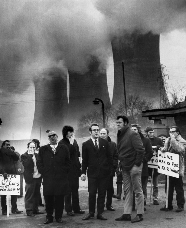 Picketing at the entrance to Agecroft power station, Pendlebury with clouds of vapour still drift from the cooling towers in the background. January 17, 1972