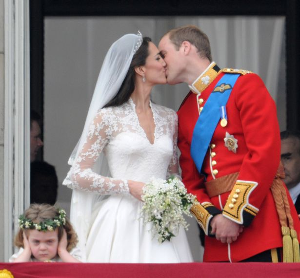 Catherine, Duchess of Cambridge and Prince William, Duke of Cambridge kiss on the balcony at Buckingham Palace on April 29, 2011 in London, England. 