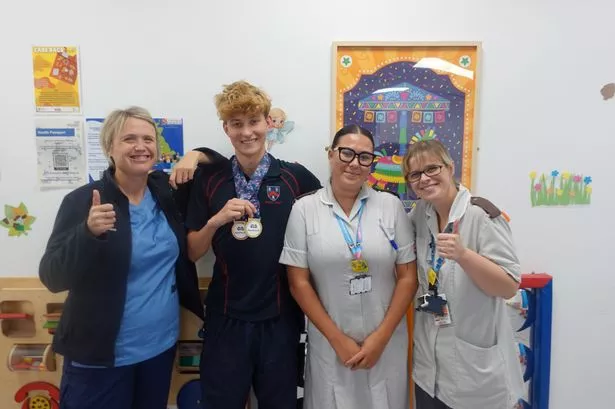 Ashby visits Bristol Royal Hospital for Children outpatients ward with his championship medals