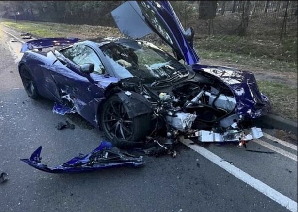 A McLaren was destroyed following a crash in Surrey