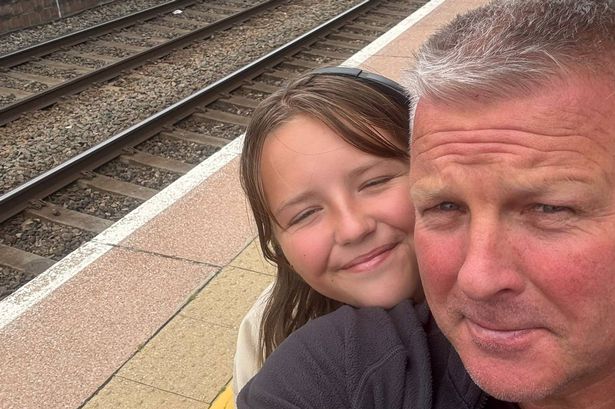 Jason taking a selfie, his daughter at train station