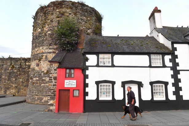 General views outside The Smallest House in Great Britain as the owners wait to receive one of Snug's new 'Small Biggie' sofas, to demonstrate the 'sofa in a box's ability to fit the most awkward of spaces, in Conwy, North Wales. Picture date: Friday August 13, 2021. PA Photo. The Smallest House in Great Britain, which measures just 72 inches wide has been given an interior makeover, including its first sofa in over 400 years. Photo credit should read: Anthony Devlin/PA Wire