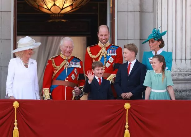 Prince Louis gives a wave