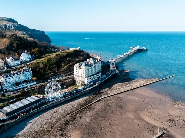 View of Llandudno pier in the centre of Llandudno UK.