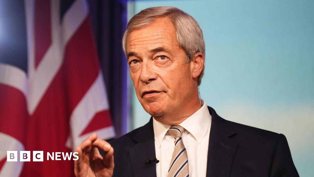 Reform UK leader Nigel Farage has grey hair parted to the side and is wearing a dark suit jacket, white shirt and striped tie