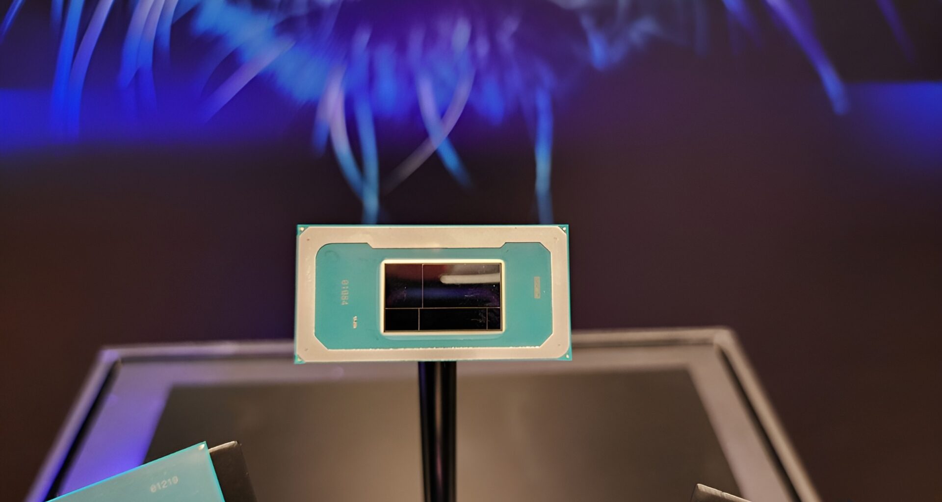 Intel processor on display with code Q D3BA4 visible.