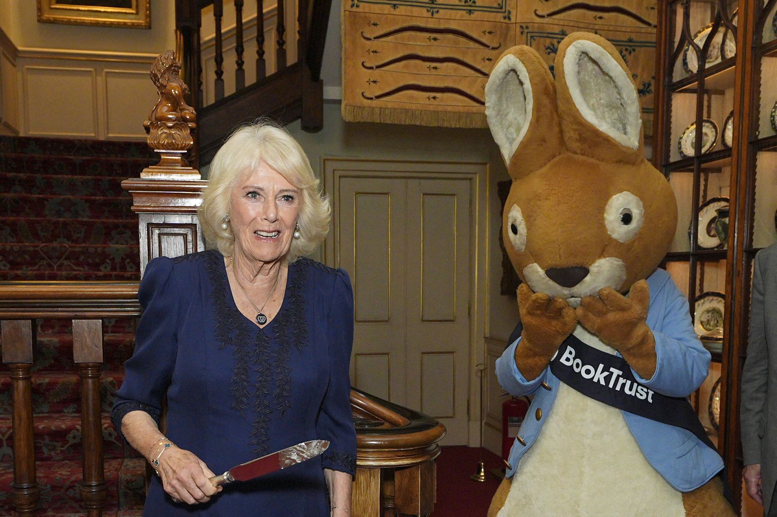 The Queen also wore a romantic necklace to celebrate the 100th anniversary of the charity BookTrust this week