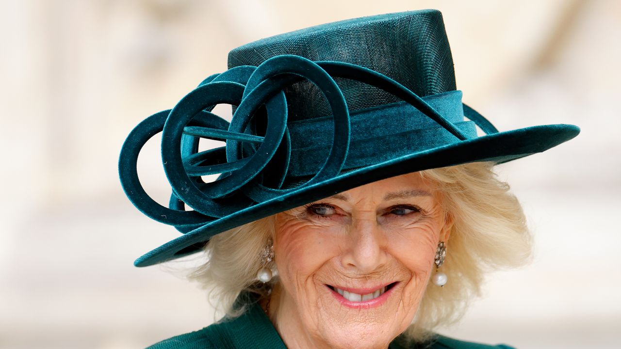 Revealed: the secretly romantic symbolism behind one of Queen Camilla's favourite brooches as she wears the antique treasure in London