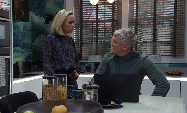 Ruby and Caleb look at each other in Mill Cottage in Emmerdale