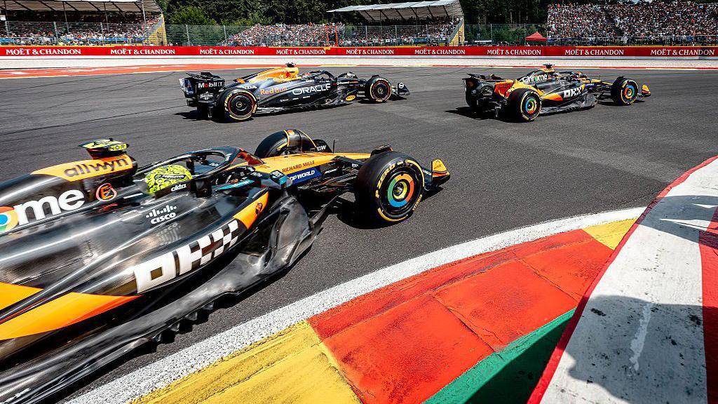 Lando Norris, Oscar Piastri and Max Verstappen on track during the Belgium GP sprint race in July 