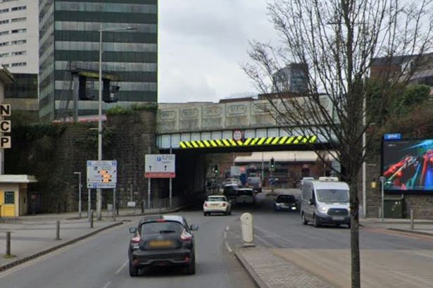The image is from Google Maps and shows cars passing under the railway bridge at Bute Terrace