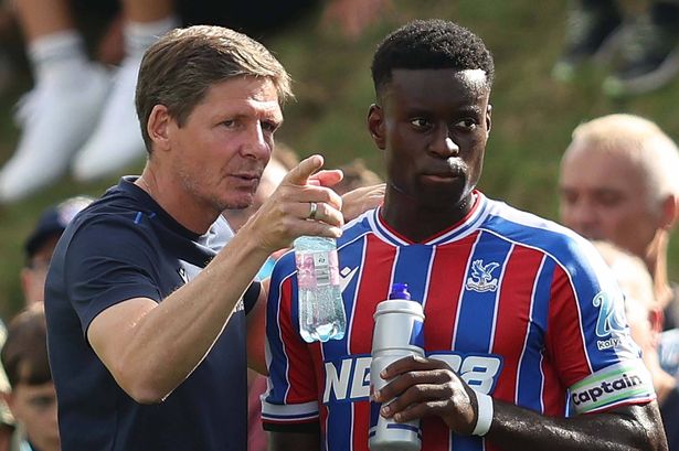 LINZ, AUSTRIA - AUGUST 1: Oliver Glasner Manager of Crystal Palace points out instructions to Marc Guehi of Crystal Palace during the pre season friendly match between Augsburg v Crystal Palace at Hofmaninger Stadium on August 1, 2025 in Linz, Austria. (Photo by Crystal Pix/MB Media/Getty Images)