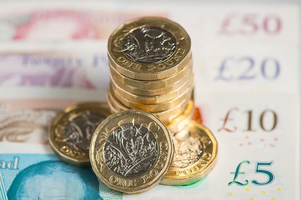 A stock image showing cash and coins