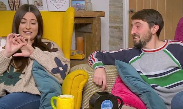Gogglebox stars on their sofa as Sophie looks at her ring