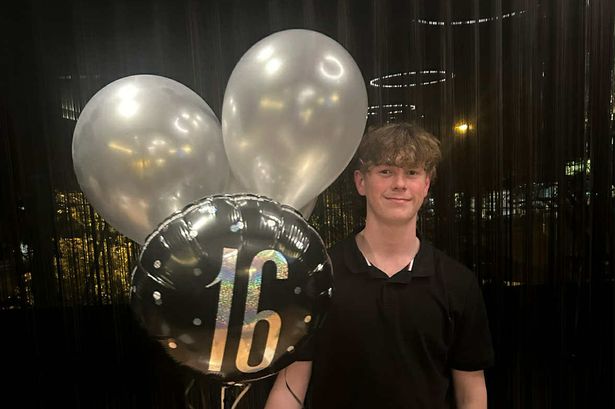 Levi Syer with birthday balloons.