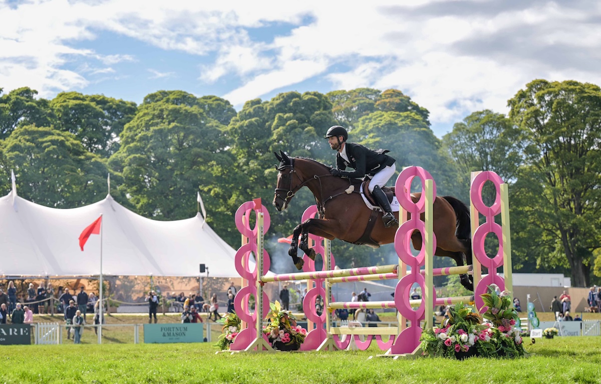 Ex-Aussie racehorse Sparky Lad and Clarke Johnston en route to success in the show jumping. Photo: Peter Nixon