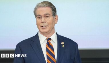 Scott Bessent, US treasury secretary, in a blue suit with a blue tie with red and yellow diagonal stripes during the Federal Reserve Board Community Bank Conference in Washington, DC.
