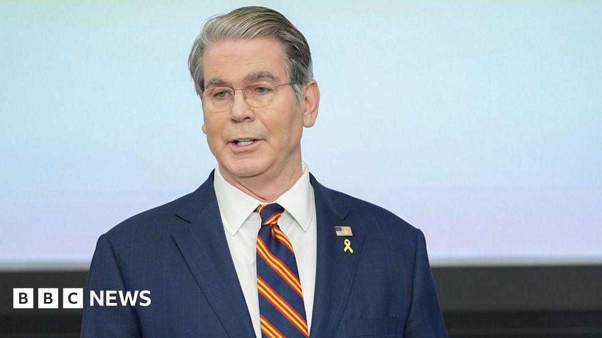 Scott Bessent, US treasury secretary, in a blue suit with a blue tie with red and yellow diagonal stripes during the Federal Reserve Board Community Bank Conference in Washington, DC.