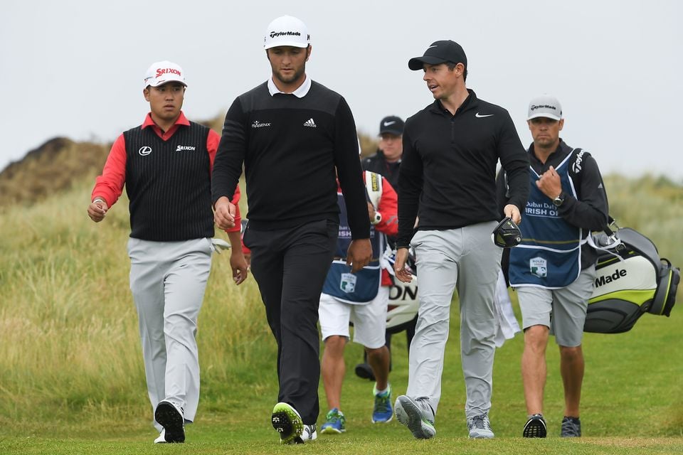 Hideki Matsuyama of Japan, left, Jon Rahm of Spain and Rory McIlroy of Northern Ireland walk down the fourth fairway during Day 1 of the Dubai Duty Free Irish Open Golf Championship at Portstewart Golf Club in Portstewart, Co Derry. (Photo By Brendan Moran/Sportsfile via Getty Images)