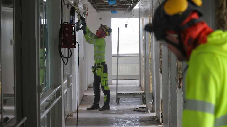 Construction workers making repairs.