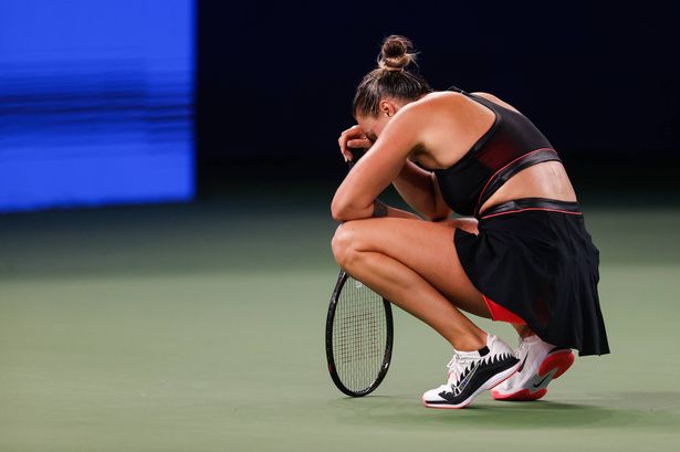 Aryna Sabalenka looks dejected