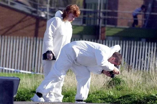 Police forensic officers at the scene of the Tony Lawlor shooting in Netherley