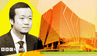 Chen Zhi alongside a company building