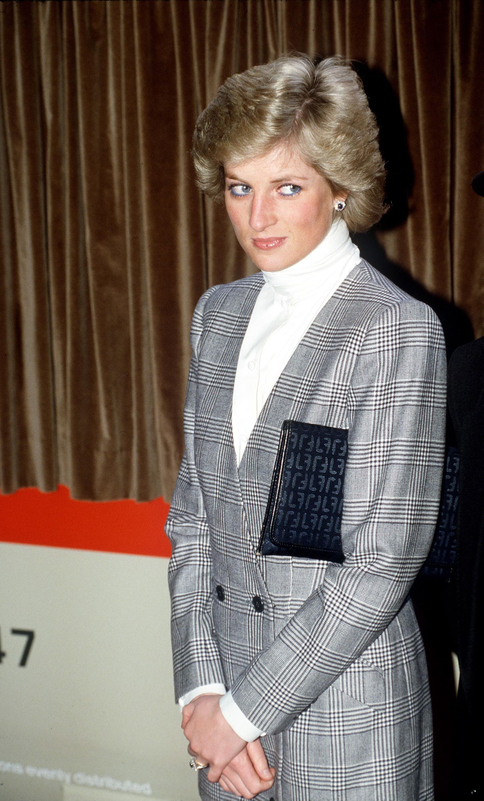 Princess Diana wore a Prince of Wales check suit by Catherine Walker on a trip to Paddington in 1988.