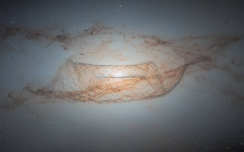 NASA Hubble image of a galaxy with cosmic dust structures