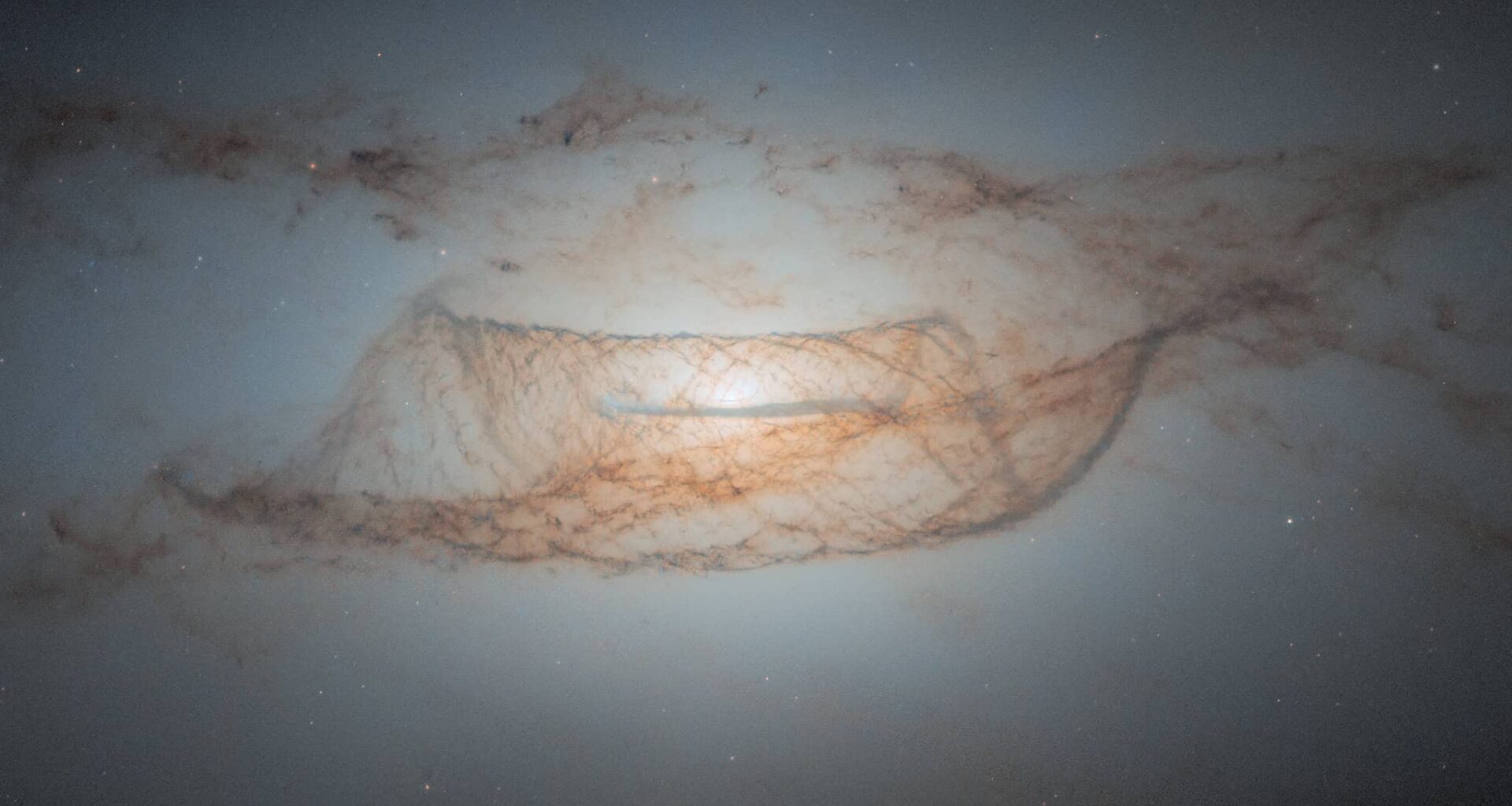 NASA Hubble image of a galaxy with cosmic dust structures