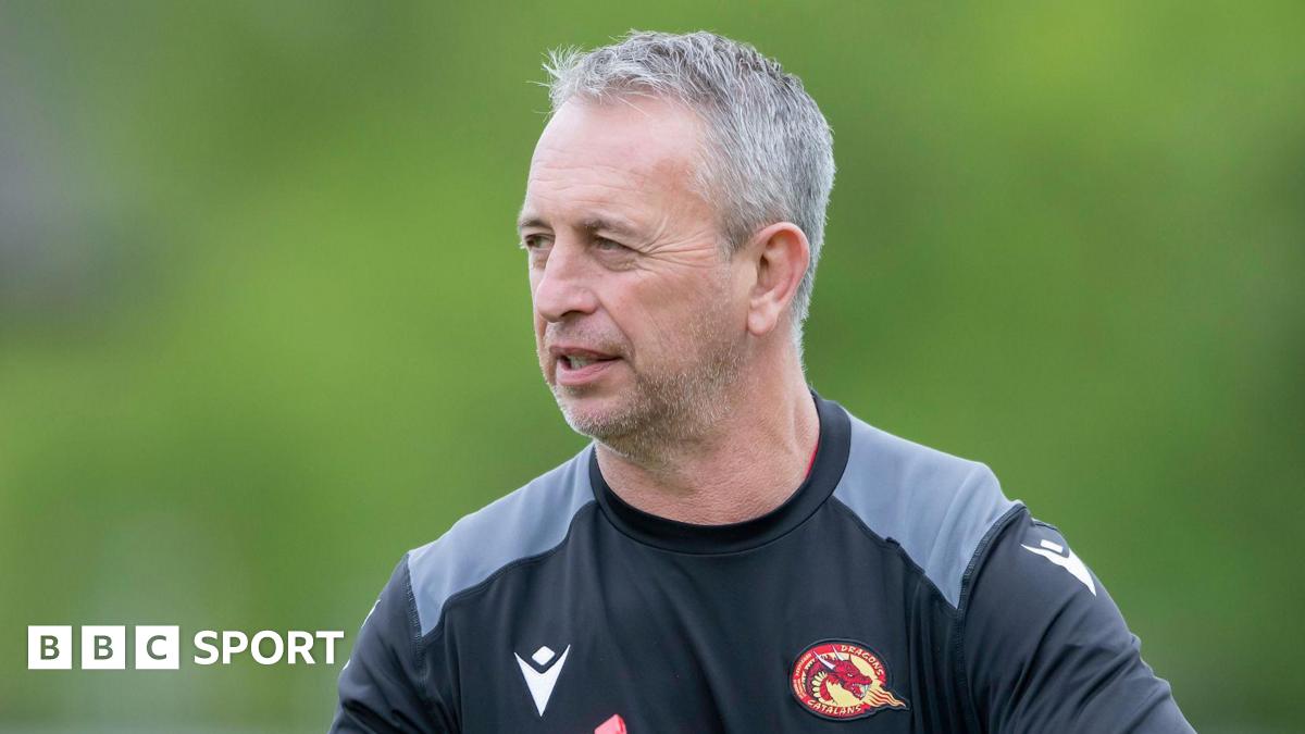 Steve McNamara wearing a Catalans Dragons sweatshirt