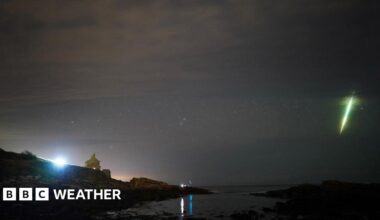 A Draconid meteor sends a bright green streak in the night sky
