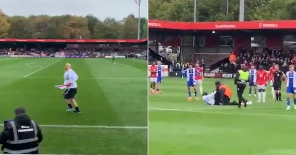 Pitch invaders storm football match in 'Gary Neville is a traitor' protest | Football | Sport