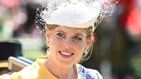 Getty Images Princess Beatrice wearing a white hat with mesh