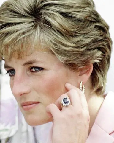 Tim Graham Photo Library via Getty Images Princess Diana wearing her sapphire engagement ring from Charles in 1991.